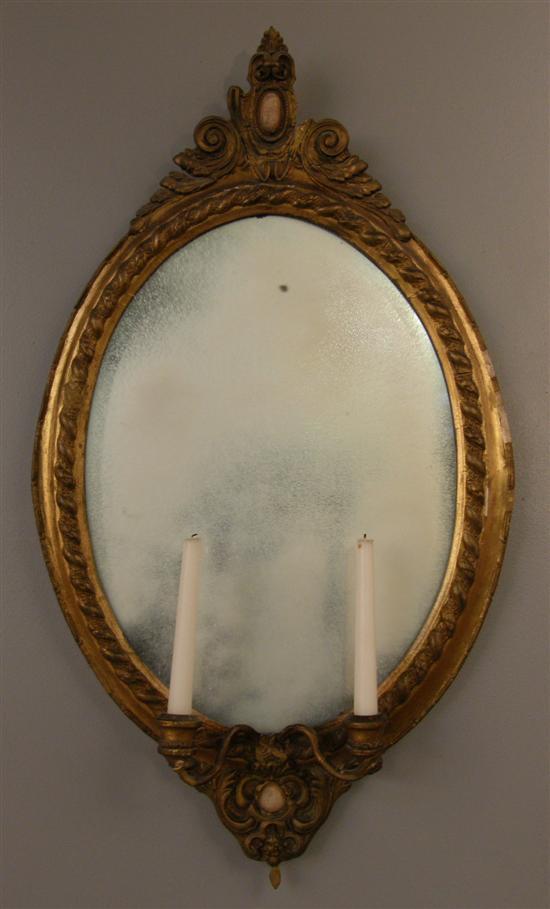 Appraisal: th century carved wood and gilt gesso oval framed girandole