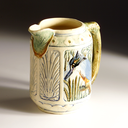 Appraisal: WELLER Zona pitcher with panels of kingfisher and landscape dark