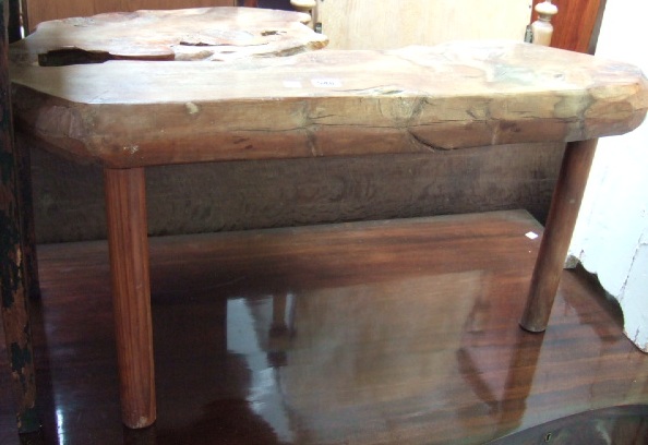 Appraisal: A yew and pine occasional table with a segment trunk