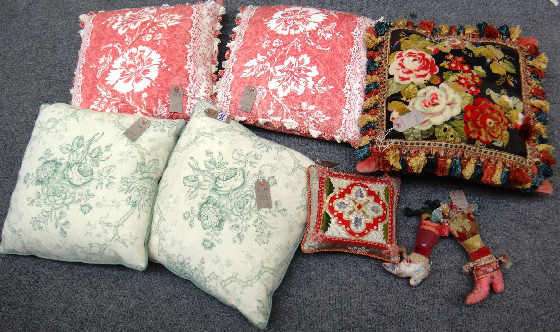 Appraisal: A selection of cushions and two 'boot' pulls