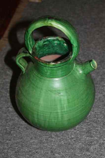 Appraisal: A GREEN GLAZED RUSTIC POTTERY WATER JUG