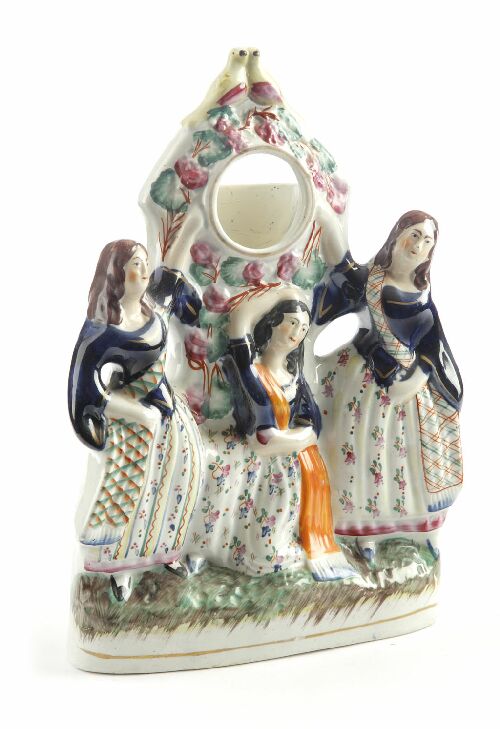 Appraisal: A th century Staffordshire watch stand decorated with three girls