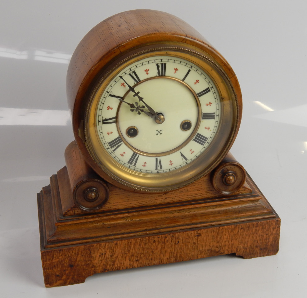 Appraisal: A thC drum head eight day mantel clock in oak