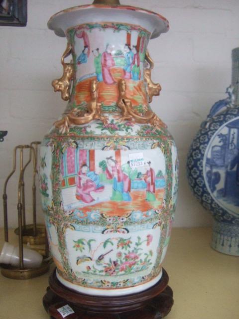 Appraisal: A pair of Cantonese vases th century decorated with panels