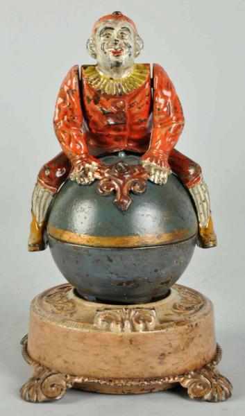 Appraisal: Cast Iron Clown on Globe Mechanical Bank Description Manufactured by