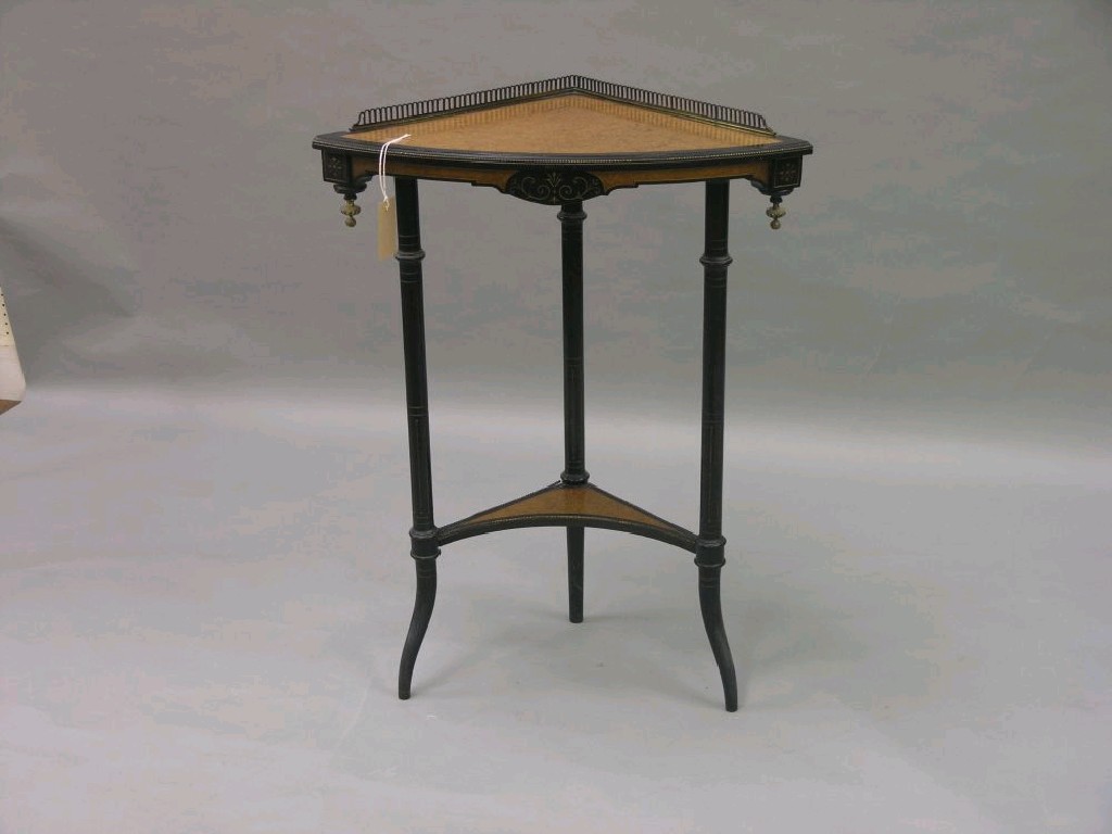 Appraisal: A mid Victorian burr walnut and ebonised corner fitting table