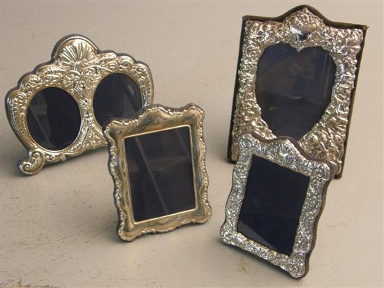 Appraisal: Four silver photograph frames each with embossed decoration and velvet