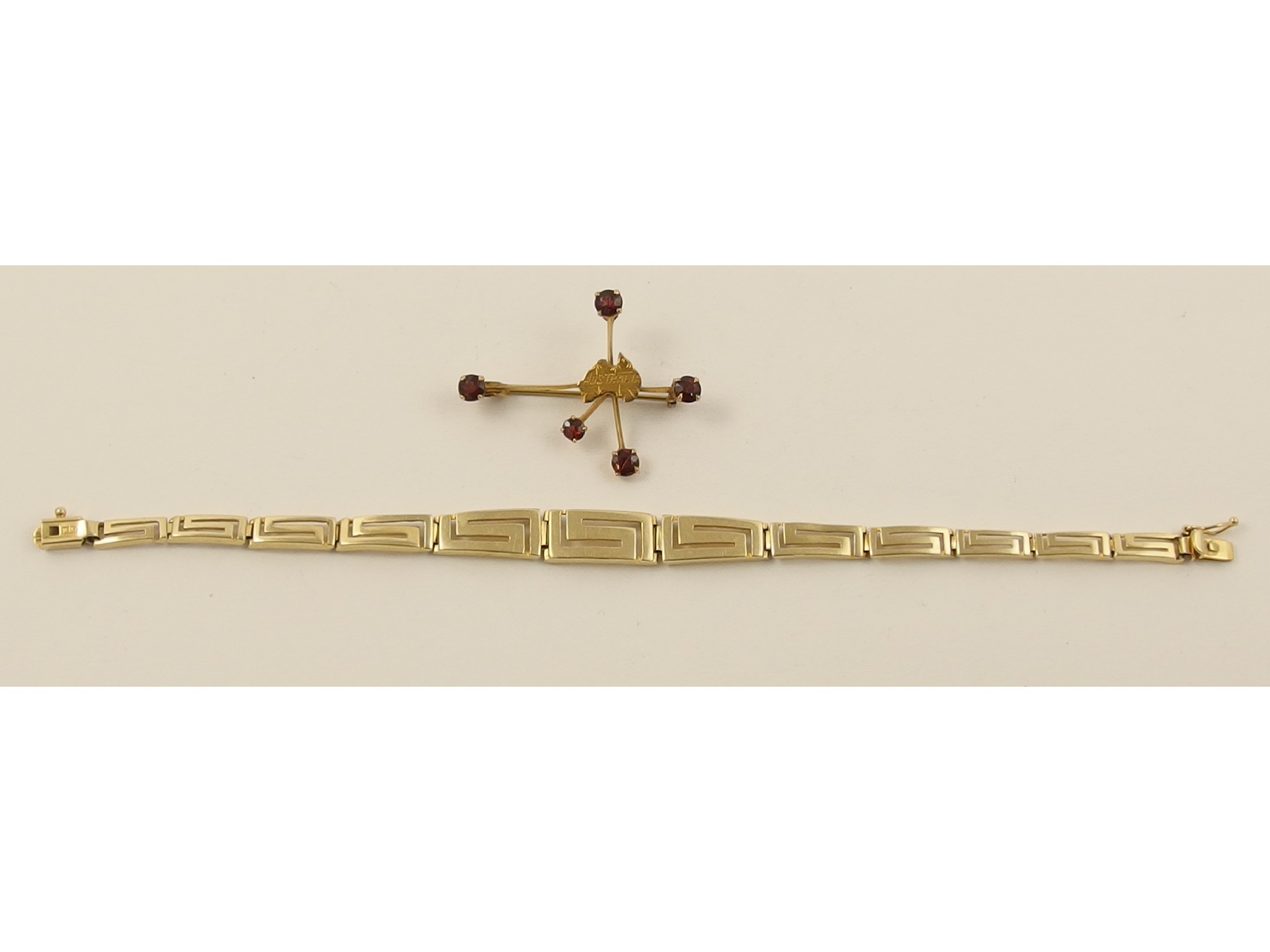 Appraisal: A ct tapered Greek key pattern bracelet together with a