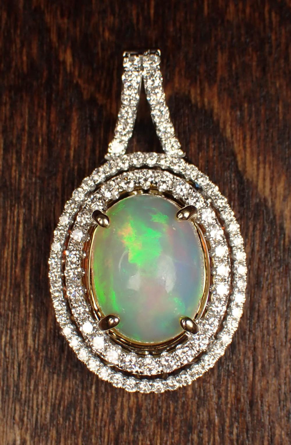 Appraisal: OPAL DIAMOND AND FOURTEEN KARAT GOLD PENDANT The white and