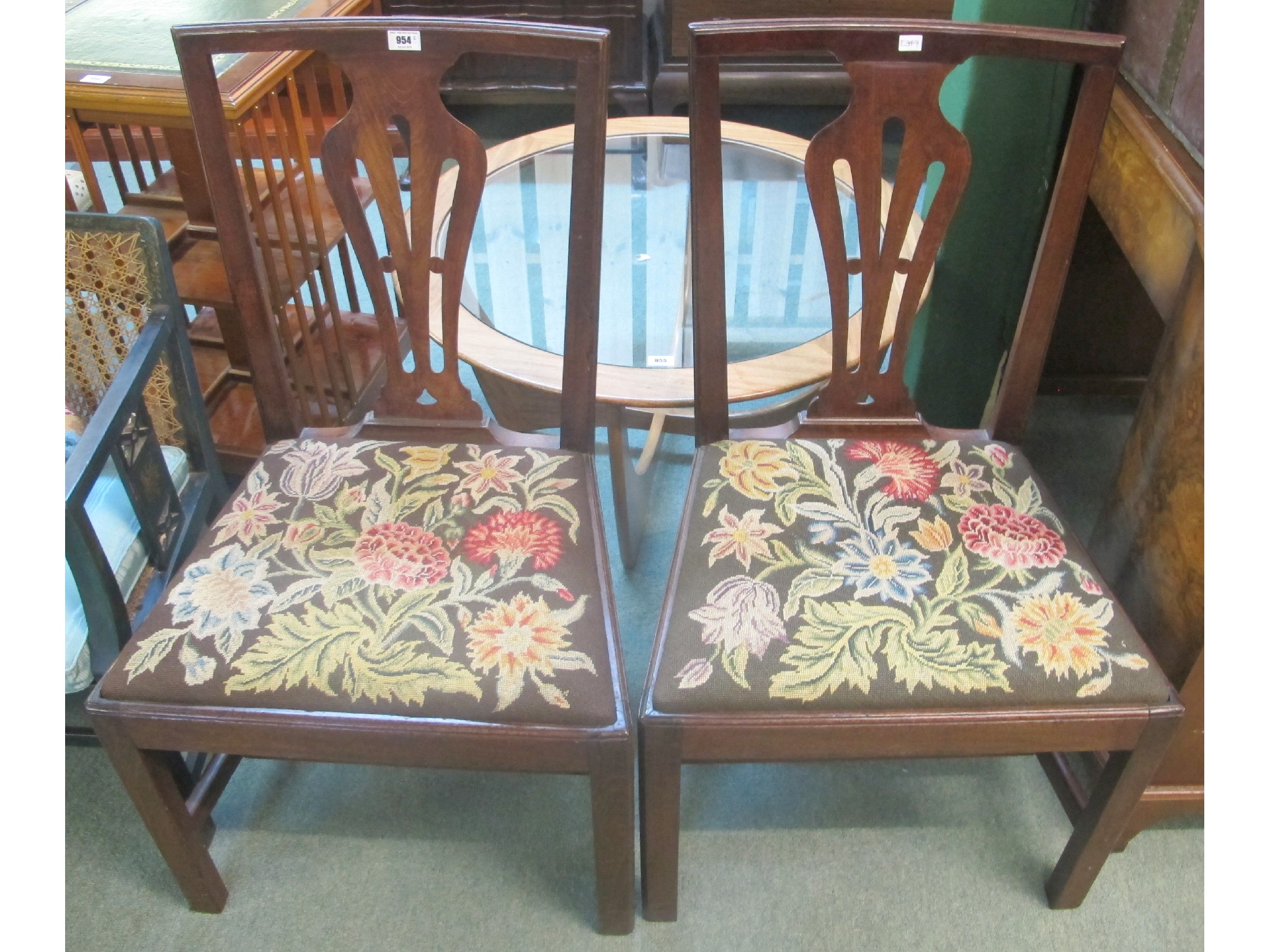 Appraisal: A pair of mahogany chairs with vase shapes backs