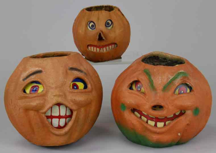 Appraisal: THREE HALLOWEEN JACK-O-LANTERNS One early German pressed cardboard with extended