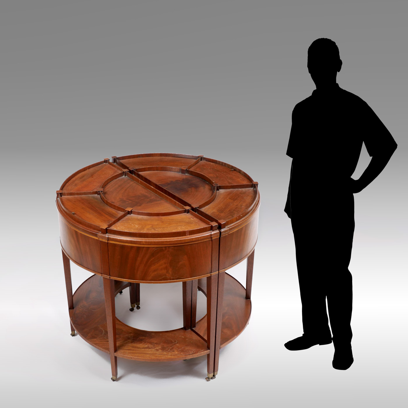 Appraisal: MOST UNUSUAL METAMORPHIC COMPARTMENTED DRUM TABLE A rare mahogany Drum