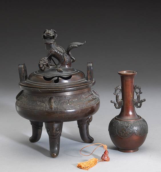 Appraisal: Two patinated bronze vessels The first a Chinese style tripod