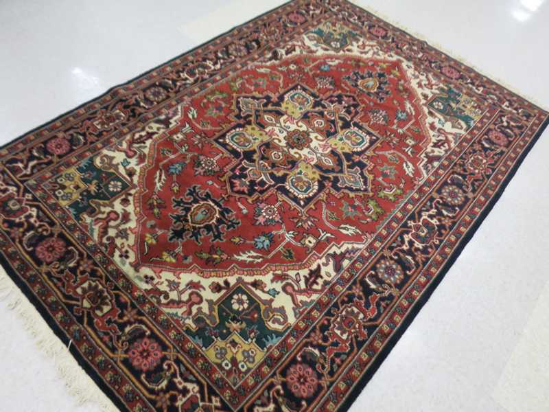 Appraisal: HAND KNOTTED ORIENTAL CARPET Indo-Persian Serapi design ' x '