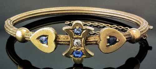 Appraisal: A late Victorian gold coloured metal diamond and sapphire set