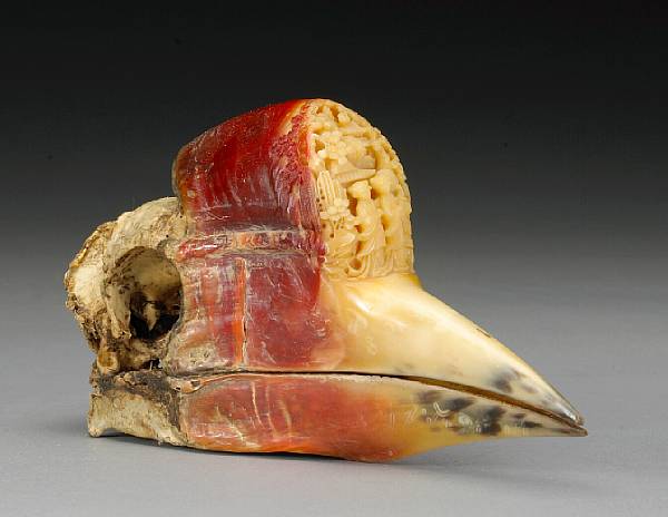 Appraisal: A carved hornbill casque th Century The sides of the