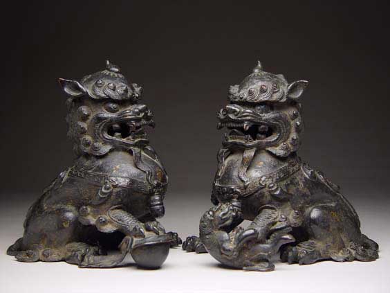 Appraisal: PAIR ANTIQUE BRONZE LIONS Pair of well cast antique Chinese