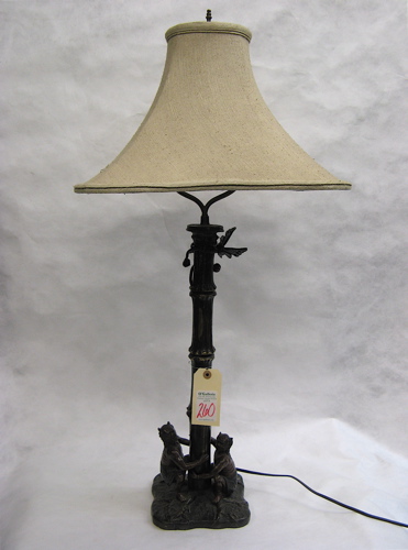 Appraisal: BRONZE FIGURAL TABLE LAMP Lucifer-like patinated bronze figures squat on