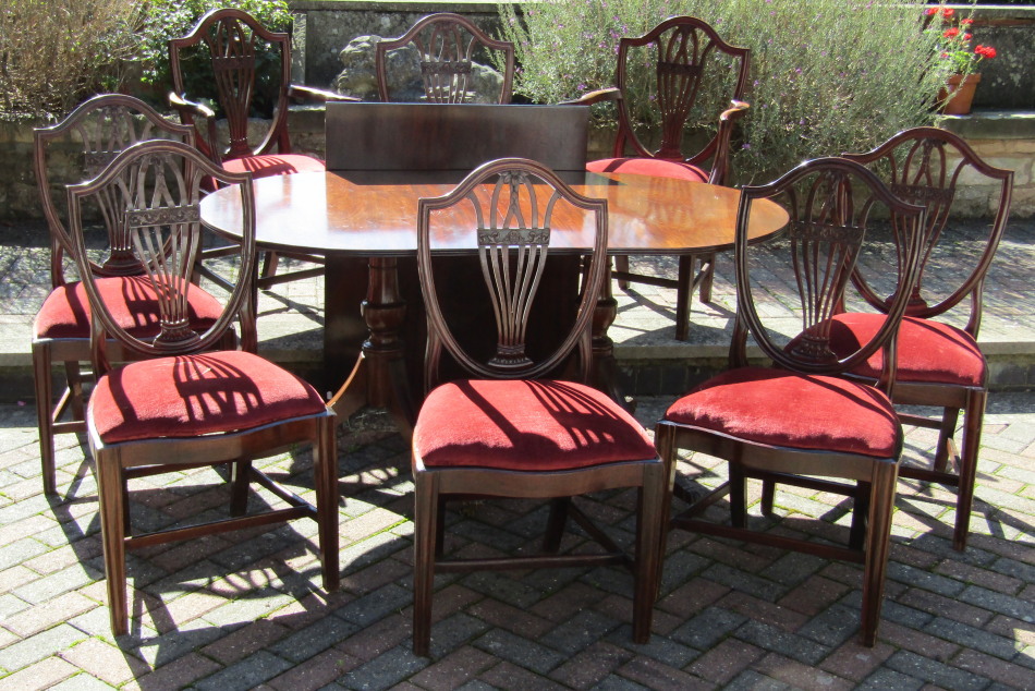 Appraisal: A set of eight Hepplewhite style dining chairs with pierced