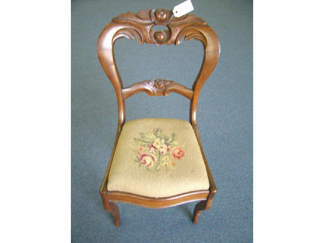 Appraisal: Victorian Carved Walnut Side Chair fine needlepoint seat