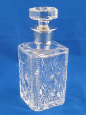 Appraisal: A silver mounted cut glass spirit decanter Birmingham rubbed