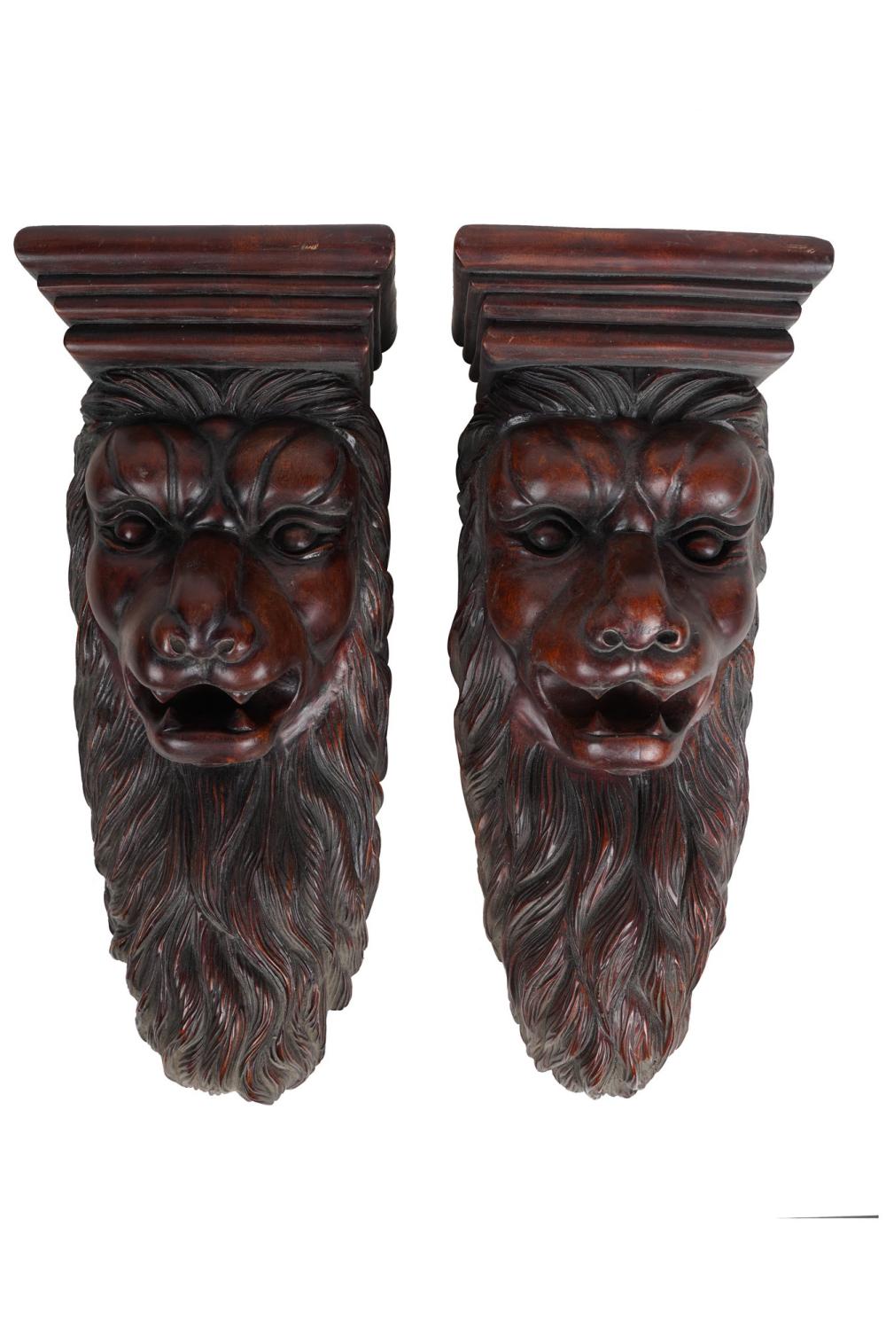 Appraisal: PAIR OF CARVED WOOD LION BRACKETSCondition with wear to tops