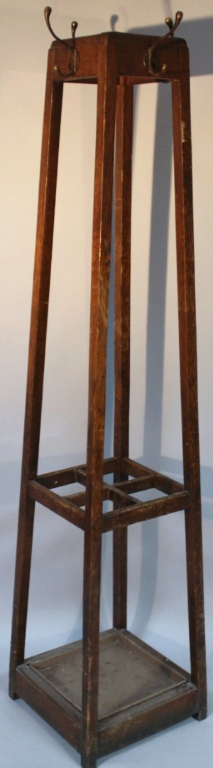 Appraisal: An early thC oak stained hall stand with metal pegs