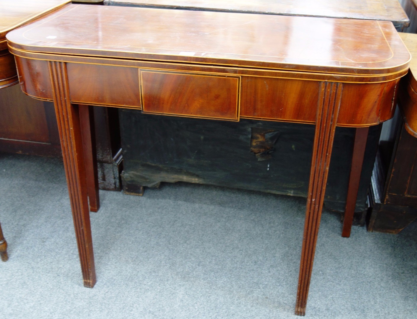 Appraisal: A late Regency inlaid mahogany fold over tea table on