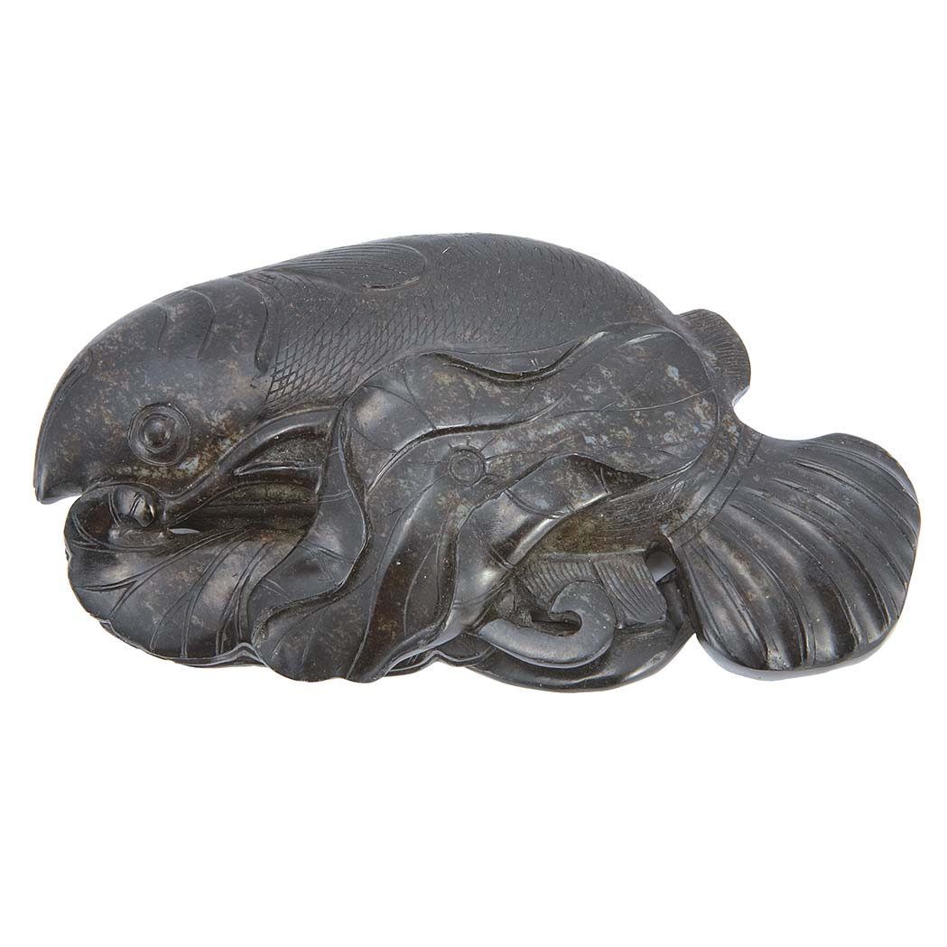 Appraisal: Chinese Black Jade Carp th th Century Carved swimming beneath