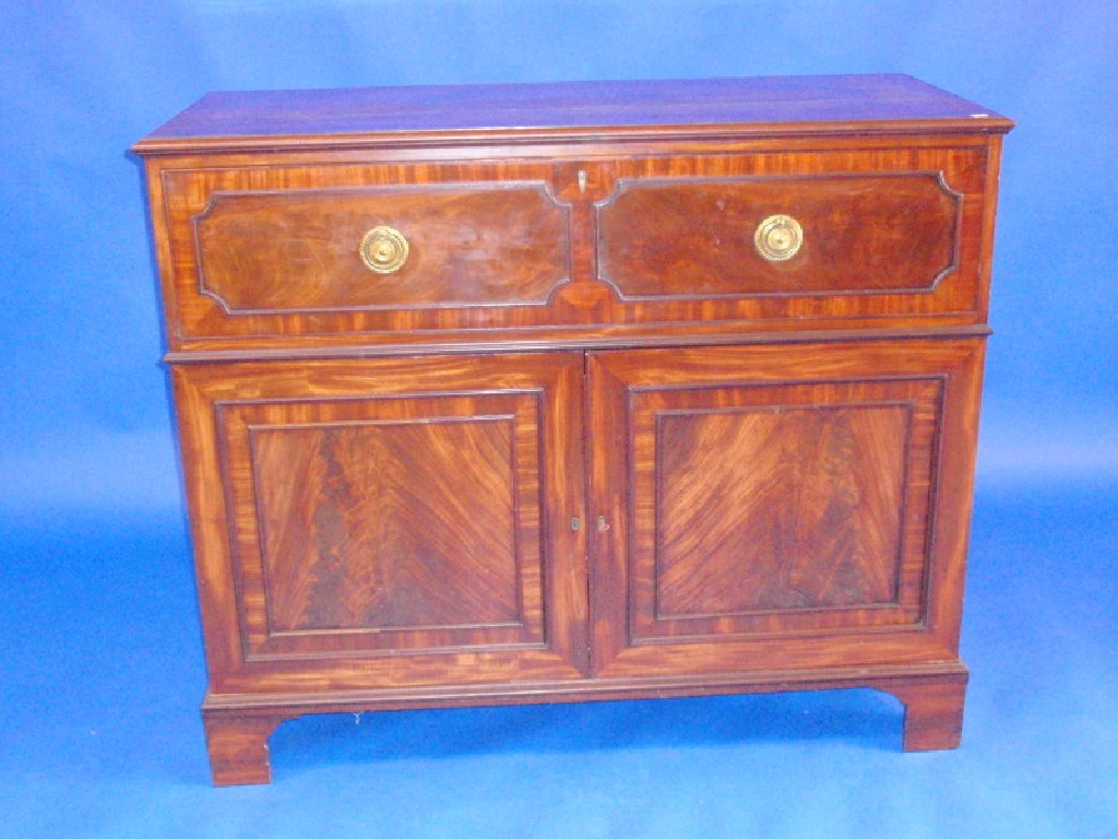 Appraisal: A Regency mahogany secretaire cabinet with fitted secretaire drawer over