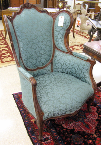 Appraisal: LOUIS XV STYLE WINGBACK ARMCHAIR American c 's having a