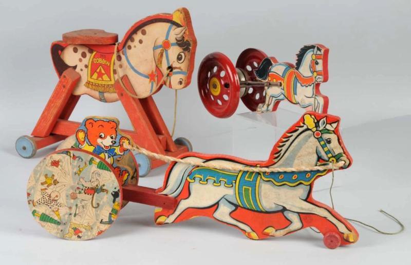 Appraisal: Lot of Paper on Wood Horse-Drawn Pull Toys Description One