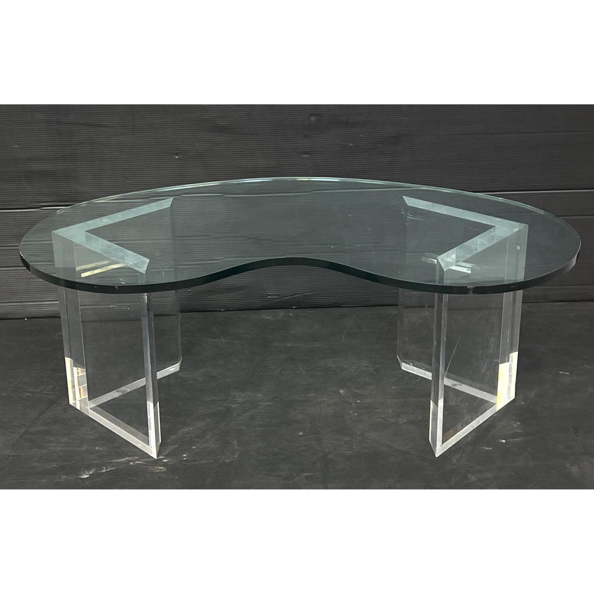 Appraisal: Lucite Base Glass Amoeba Shaped Coffee table Dimensions H inches