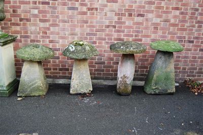 Appraisal: Four staddle stones with mushroom tops