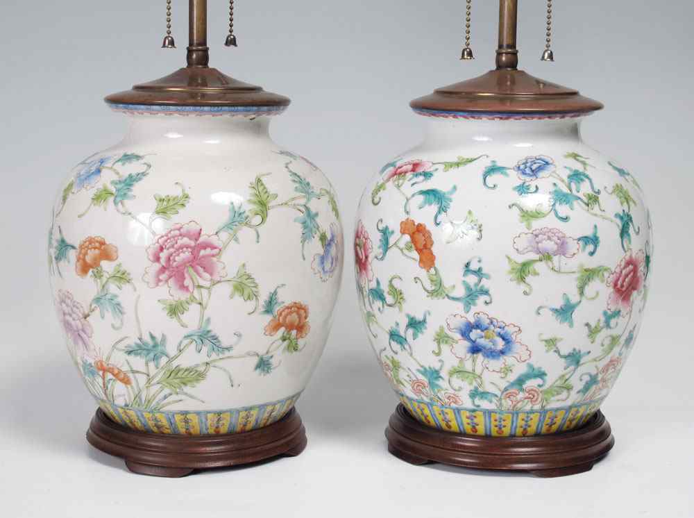 Appraisal: PAIR CHINESE POLYCHROME CERAMIC LAMPS Floral motif Chinese export earthenware