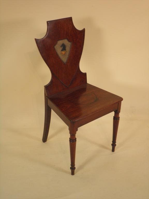 Appraisal: A George III mahogany hall chair the shield shaped back