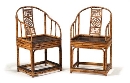 Appraisal: Pair of Chinese bamboo horseshoe chairs th century Of split