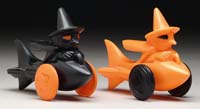 Appraisal: TWO WITCHES ON ROCKETS Black witch in rocket with orange