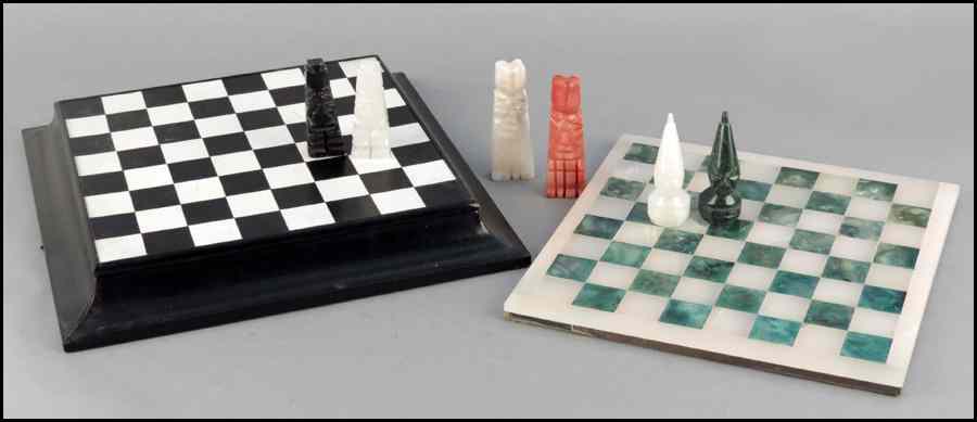 Appraisal: COLLECTION OF THREE CARVED STONE CHESS SETS Includes two complete