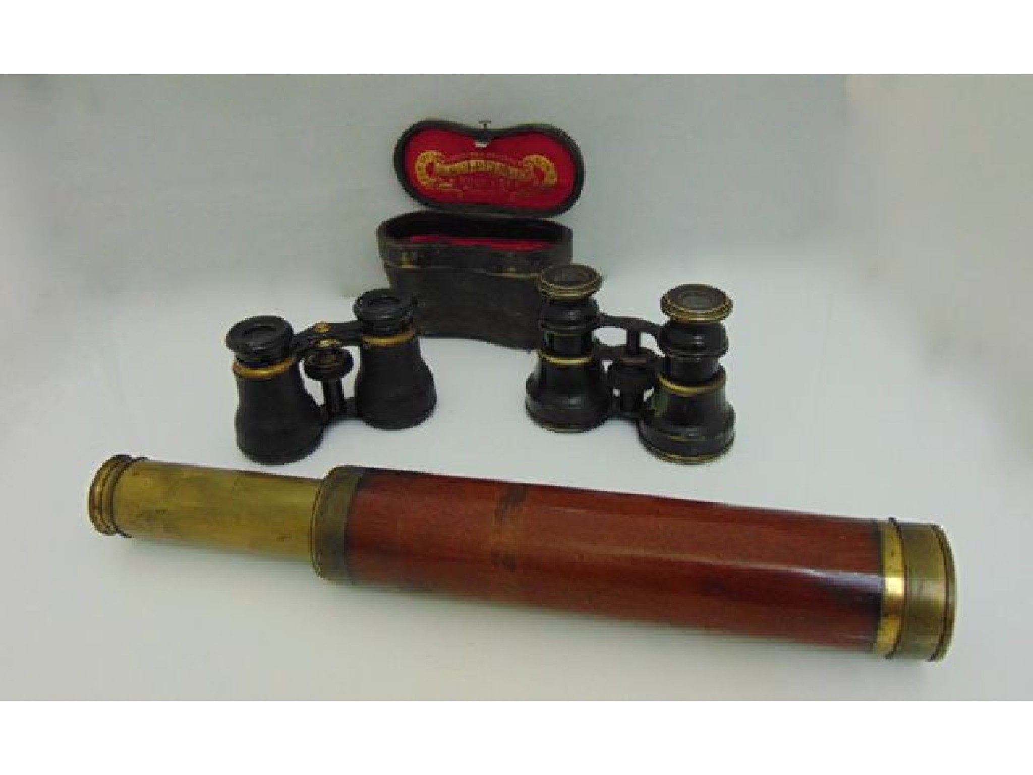 Appraisal: A three drawer brass and mahogany telescope together with two