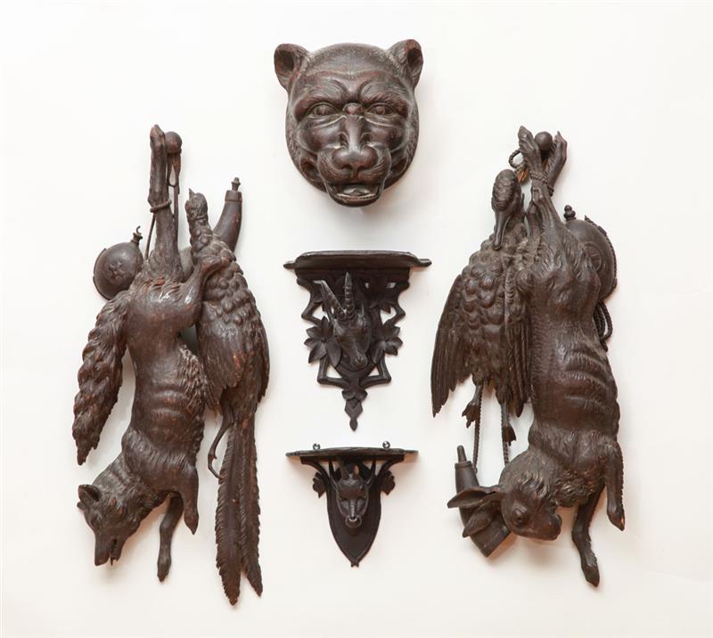 Appraisal: PAIR OF ENGLISH CARVED HARDWOOD ANIMAL TROPHIES Together with a