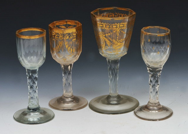 Appraisal: A GROUP OF FOUR DRINKING GLASSES with gilded decoration and