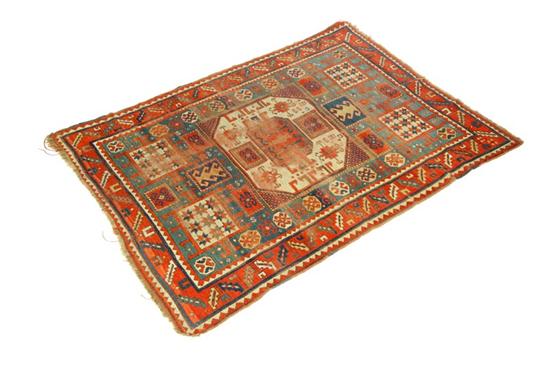 Appraisal: ORIENTAL RUG Kazak Abrash green with central ivory medallion and