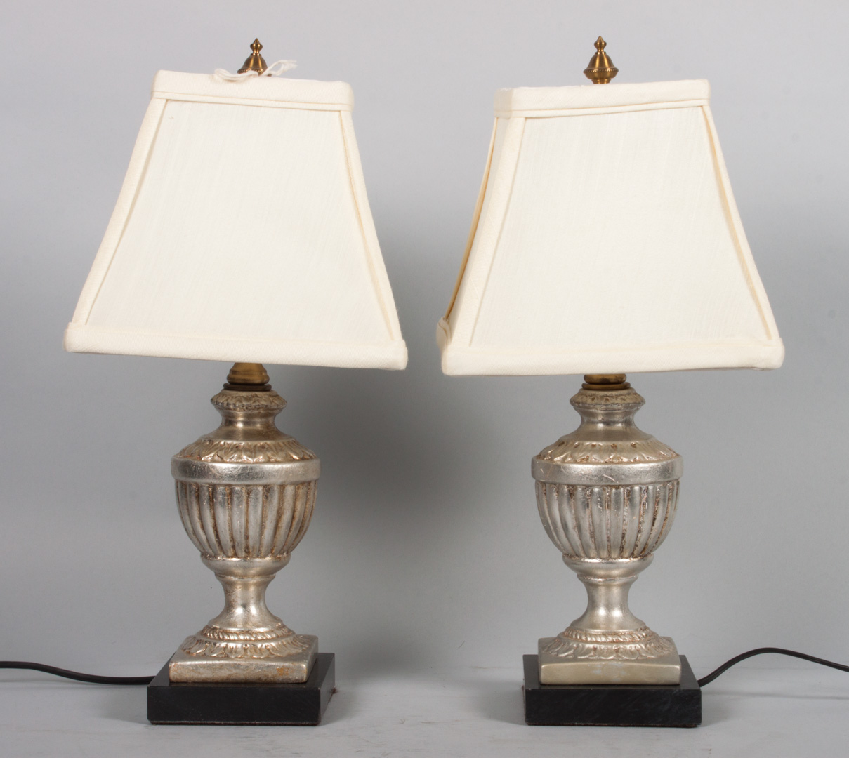 Appraisal: Pair of silvered metal urn lamps with shades in H