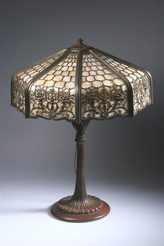 Appraisal: BRONZE AND SLAG GLASS TABLE LAMP Circa Octagonal shade with