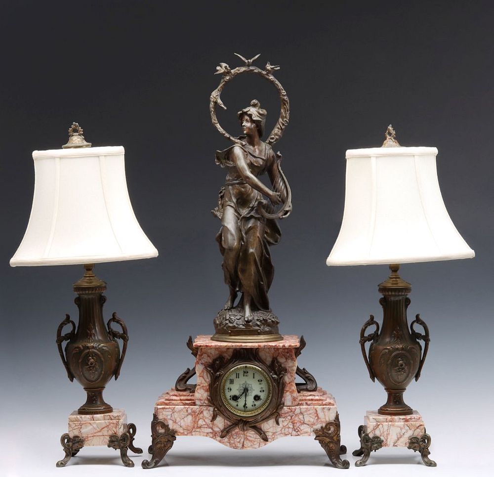 Appraisal: A TH CENTURY FRENCH GARNITURE WITH STATUE CLOCK The pink