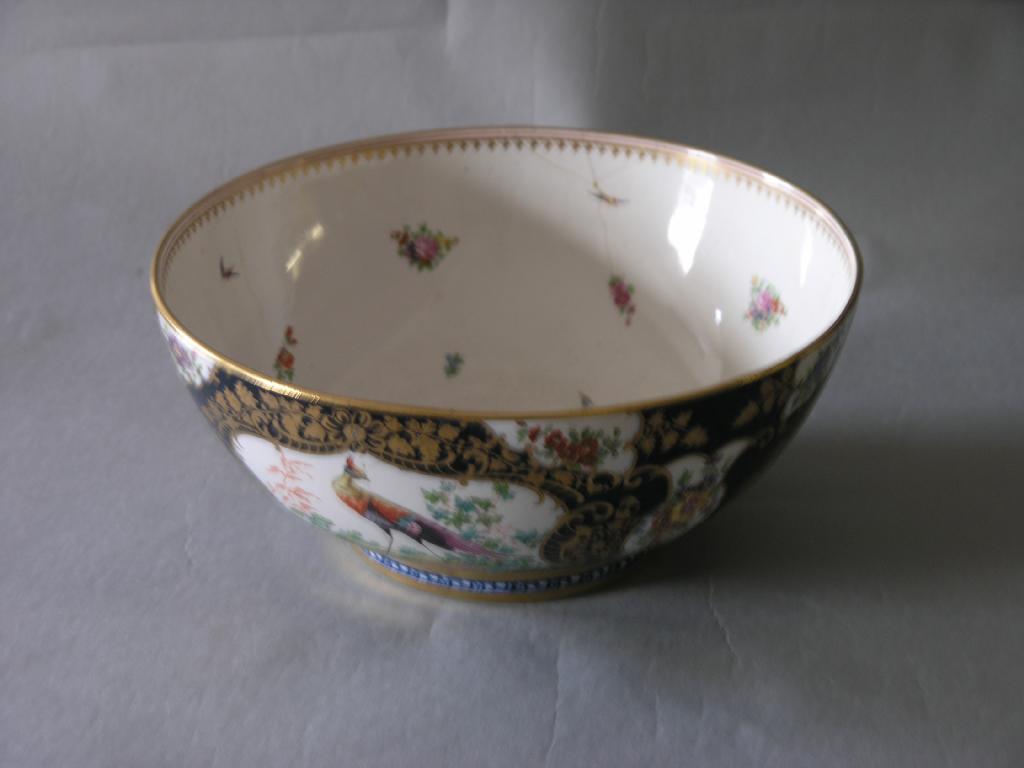 Appraisal: A large Booth's earthenware bowl painted with exotic birds and