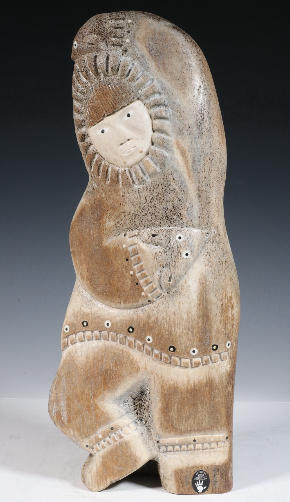 Appraisal: INUIT WHALEBONE SCULPTURE Double-Sided Portrait of Husband and Wife Carrying