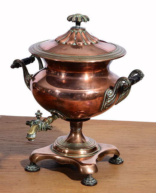 Appraisal: A GEORGE IV COPPER TEA URN with ring turned ebonised