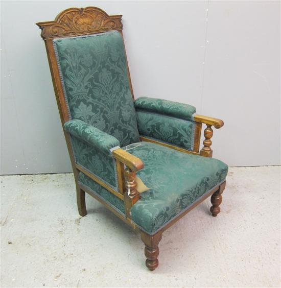 Appraisal: th century oak armchair with carved top rail padded back